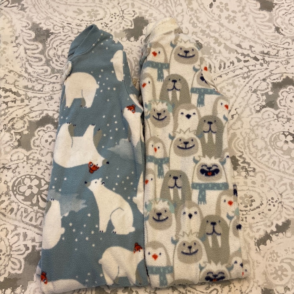 Two pairs Carter’s one piece feet pajamas size 2T